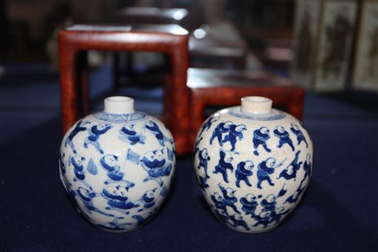 Two Chinese crackleglaze small blue and white vases, painted with figures, late 19th century plus wood scholars stand, tallest 7cm